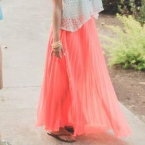 Bebe - pleated, flowy, peachy orange-ish maxi skirt. Size Medium